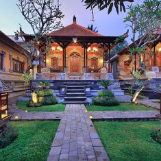 an outdoor courtyard with steps leading up to the building