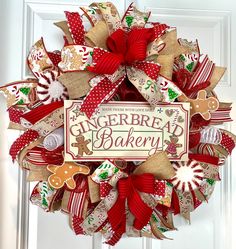 a christmas wreath on the front door with gingerbread bakery written on it