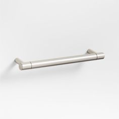 a stainless steel toilet roll holder on a white background