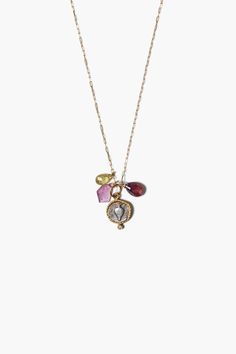 14k gold chain necklace featuring a gold wrapped silver coin with a vase motif, white diamond inlay, tourmaline, and garnet drops. 14k yellow gold, sterling silver, .02ct white diamond, pink & yellow tourmaline, red garnet. 18" in length. Handmade in Los Angeles. This item is one-of-a-kind. Vintage Charm Brass Pendant Necklace, Red Pendant Necklace With Vintage Charm, Red Vintage Necklace With Charm, Vintage Charm Brass Dangle Necklace, Vintage Charm Gold-tone Brass Necklace, Gold Wrap, Silver Coin, Gold Chain Necklace, Silver Coins