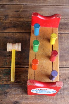 a wooden toy with different colored toys on it and the words, what do you think?