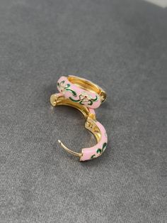 What's Inside 🎁: 1x pair of Gold Plated Pink Floral Multicolour Dainty Enamel Huggie Hoop Earrings  🌸🌸 Earring Size 📏:  2 cm (0.78 inches) 🌍📦Free worldwide shipping  🔒30-day money-back guarantee ️Handcrafted & Handmade  🌱🌿Style sustainability, choose eco-friendly 🙏 Your support fuels my dream of creating one of a kind, exquisite handcrafted jewelry.  💎 Every custom piece is a testament to my dedication, creativity and passion. Pink Enamel Hoop Earrings, Multicolor Enamel Hoop Earrings, Pink Enamel Hoop Jewelry, Pink Flower Hoop Earrings, Floral Hoops, Golden Earrings, Flower Vintage, Huggie Hoop Earrings, Earrings Boho