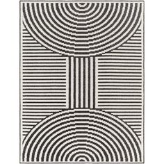 a black and white rug with circles on it