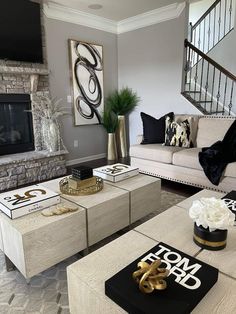 a living room filled with furniture and a fire place in front of a stone fireplace