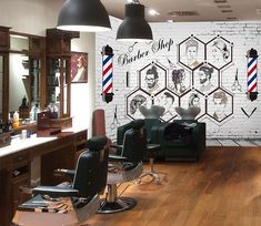 a barber shop with chairs, lights and wallpaper on the walls in front of it