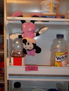 a refrigerator filled with lots of different types of food and drinks on top of it