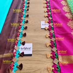 several pieces of colorful fabric on display in a store