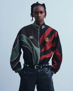 Japanese label @children_of_the_discordance has teamed up with @umbro on a seven-garment collection that channels the sportswear giant’s ‘90s silhouettes. Founded by Hideaki Shikama, the label is known for its sophisticated upcycled garments and vintage-inspired pieces. This latest drop takes cues from Umbro’s ‘90s football apparel, particularly the Eric Cantona-era Manchester United teams. The collection features split-designed tops and bottoms, combining technical fabrics with denim, cable ... Manchester United Team, Cotton Poplin Shirt, Football Outfits, 90s Inspired, Jersey Top, Apparel Design, Mens Street Style, Track Jackets, Retro Inspired