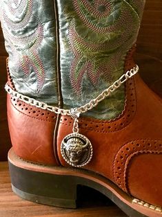 Beautiful hand crafted boot jewelry. These are faux silver Buffalo heads. perfect for any cowgirls boots.  This boot bracelet  has Lobster clasp.   This is a Unique style not to be found anywhere but Old hands Creations! This one is 15" in total length. Please check out our other items as some are complimentary to this item like a scarf slide or pendant. If you buy 2 or more items you will get 15% off! Spend $50 and get 20% off. We can ship multiple items for one normal shipping cost. We take cu Cowboy Motorcycle, Cowgirls Boots, Cowboy Jewelry, Buffalo Head, Scarf Slide, Motorcycle Boot, Boot Chains, Bridal Boots, Boot Bracelet