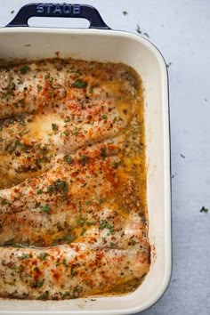 a casserole dish with meat and vegetables in it