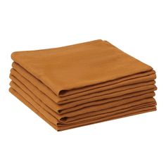 a stack of tan cloths folded on top of each other