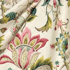 a close up view of the fabric with flowers and leaves on it, as well as birds