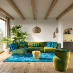 a living room filled with lots of furniture and plants on top of a wooden floor