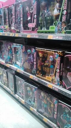 there are many dolls on the shelves in this toy store, and one is for sale