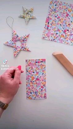 someone is making paper stars out of construction material