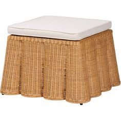 a wicker stool with a cushion on top