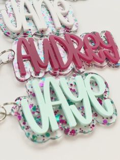 "Ready to add a little fun to your bags? Personalized acrylic keychain is a perfect addition to any backpack, diaper bag, sports bag, swim bag, lunch box, etc.!  Also perfect for bridal parties.  The options are endless. D E T A I L S: - Keychain is cut from 1/8\" quality acrylic. - Back is glitter acrylic. - Keychain will measure 3-4\".  Height will vary based on length of name. - Gold or silver lobster clasp included. P E R S O N A L I Z A T I O N: - Please include the name you would like on your keychain.  Double check your spelling as we will copy and paste what you have typed. P L E A S E NOTE: -Acrylic is plastic and if hit or dropped on a hard surface it could possibly break. We are not responsible for broken or damaged keychains/bag tags. Please handle with care. -No returns or ref Trendy Personalized White Keychains, Trendy White Personalized Keychains, Playful Pink Keychain For Personal Use, Trendy White Personalized Gift Keychain, Cute Green Keychains For Gifts, Custom Name Pink Keychains For School, Cute Customized Keychains For Personalized Gift, Fun Pink Keychain For Gifts, Fun Pink Keychain As Gift