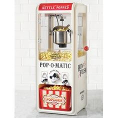 an old fashioned popcorn machine with pop - o - matic