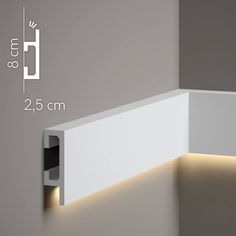 an image of a white wall light that is on the side of a wall with measurements