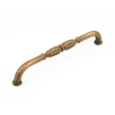 an antique brass handle on a white background