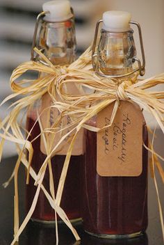 two jars filled with jam sitting on top of a table