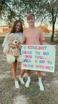 two people holding up a sign that says i couldn bear to go, who you, all u go to hoo with me?