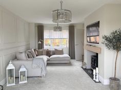 a living room filled with furniture and a fire place