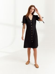 "MONICA is a knee length linen button down dress. DETAILS - Center front buttons - V neck - Knee length - Fitted bodice - No pockets - Oeko-Tex certified 100% lightweight linen - Cut and sewn to order just for you in our studio COLOR - Black, you can also choose other colors above - Fabric samples are available here https://www.etsy.com/listing/586569696/linen-fabric-samples SIZING & FIT - Fits true to size - Length (shoulder to hem) is approximately 39 inches / 99 cm - Bust approximately 33 Chic Linen Button-up Dress, Chic Short Sleeve Linen Dress With Buttons, Fitted V-neck Linen Dress With Buttons, Fitted Linen Dress With Button Closure And Short Sleeves, Fitted Button-up Linen Dress, Chic Linen Day Dress With Buttons, Chic Daywear Linen Dress With Buttons, Chic Linen Dress With Buttons For Daywear, Chic Fitted Linen Dress With Buttons