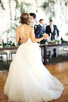 a bride and groom dance at their wedding reception