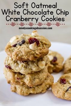 soft oatmeal white chocolate chip cranberry cookies are stacked on top of each other