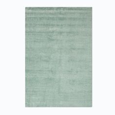 a light green rug on a white background with an area rug in the middle that is very soft