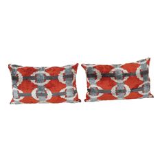 two red and grey pillows with circles on them