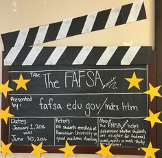 a chalk board with yellow stars on it next to a movie clapper and some other writing