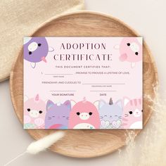 a wooden plate with a pink certificate on it that says, adoption certificate the document describes that