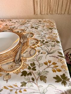 a close up of a table with a plate and silverware on top of it