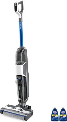 two vacuums are next to each other on a white background and one is blue