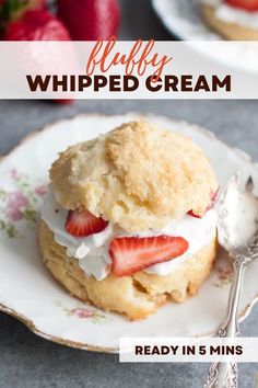 a close up of a plate of food with strawberries and whipped cream on it