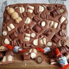 there is a chocolate tray with many different candies on it