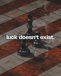 two chess pieces with the words luck doesn't existt on top of them