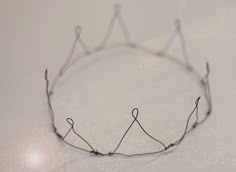 a close up of a wire crown on a table