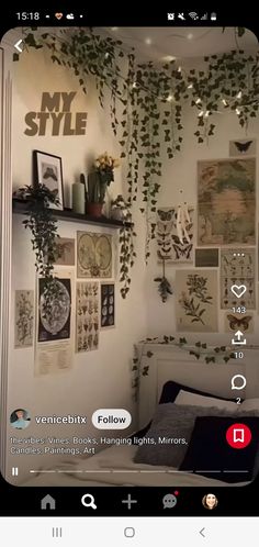 an image of a bedroom with plants on the wall and pictures hanging up above it