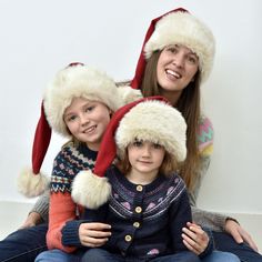 Our hand-stitched Christmas hats will definitely keep you warm on a winter's day or night, whether you're skating with your little ones, or on a festive pub-crawl. After all, they're made from the very same luxurious materials we use to make Santa's suits. The soft merino wool, huggable ivory faux fur and rich cotton lining keep Santa warm and cosy for 6 hours right up in the stratosphere on a chilly night. We tailor the hats in small, medium and large - small being suitable for children, and la Christmas Hats, Santa Suits, Luxury Christmas, Pub Crawl, Fancy Dress Accessories, Soft Red, Christmas Hat, Christmas Morning, Santa Christmas