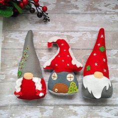 three gnome hats sitting on top of a wooden table