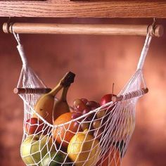 a fruit bag hanging from a wooden shelf