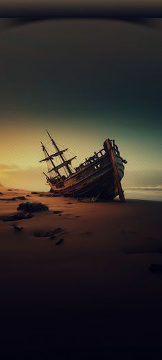 a ship sitting on top of a sandy beach