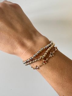 Perfect worn on its own or layered with our other bracelets. 18k gold and rhodium filled, 4mm beads 6", fits up to 6.5" Ready to ship *18k gold filled is a more affordable alternative to solid gold jewelry. Gold filled is a layer of gold bonded onto a base metal with heat and pressure that contains 100+ times more gold than gold plated jewelry.  *It is very durable and tarnish resistant.  *With proper care, gold filled jewelry can last several years. Avoid contact with harsh chemicals, perfumes, Dainty Silver Bracelets With Gold Beads, Dainty Silver Bracelet With Gold Beads, Gold Name Bracelet With Spacer Beads, Dainty Gold Beaded Bracelets With Extender, Dainty Gold Beaded Bracelet With Extender, Gold Bracelets With Round Beads And Extender, Bracelet Stack Simple, Mixed Metal Bracelet, Mixed Metal Bracelets