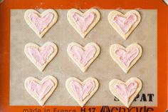 heart shaped cookies on a baking sheet ready to be made into valentine's day treats