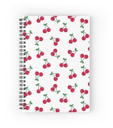 a spiral notebook with cherries on it