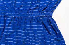 a blue dress with white lines on it