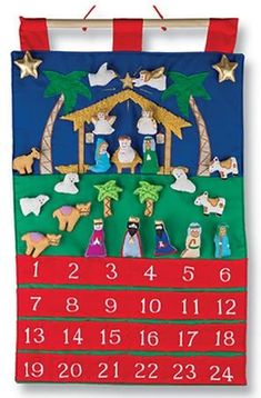 a christmas calendar hanging on a clothesline with nativity scene and stars in the sky